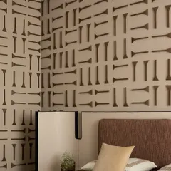 The finished 3D wooden wall panel in the son's bedroom of the 'ARAH' project. Each piece was individually crafted and placed to create this stunning, graphic pattern.