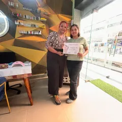 A proud moment with a newly certified nail technician. My small class sizes mean we build a great connection, and I'm here to support you even after the course ends.