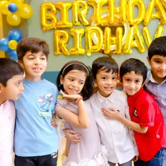 A group of friends celebrating a birthday together. We document all the important people who came to share in your child's special day.