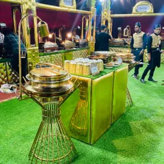 The elegant gold-themed Mughlai food station, showcasing the luxurious presentation I bring to every event.