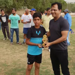 Recognizing the future of the sport is a privilege. Here, one of our budding players is being facilitated with an award by an honourable IAS Officer, marking a proud moment for the academy.