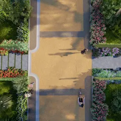An aerial concept view of a wide, pedestrian-friendly promenade in our Sakleshpur project. The design uses contrasting paving materials and is lined with flowering shrubs to create a beautiful and functional circulation spine.