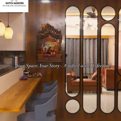 A traditional wooden mandir mounted on the wall, creating a focal point next to the breakfast bar in this open-plan home.
