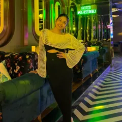 Another angle of this chic night-out outfit. The bell sleeves on the top add a touch of drama to an otherwise simple look.