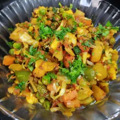 My Mix Veg sabzi is a healthy and tasty option, full of seasonal vegetables like cauliflower, peas, carrots, and beans, all cooked together in a light masala. It's a great way to get your daily veggies.