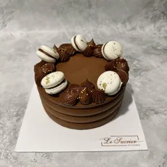 I have given my Decadent Chocolate Cake a new look, now adorned with delicate macarons. It's the same rich, fudgy Belgian chocolate cake you love, just with a little extra elegance.