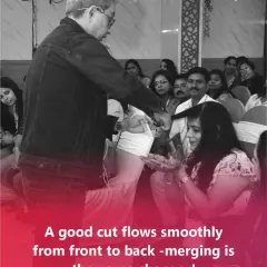 Here I am demonstrating my cutting technique to an audience. A good cut is not just about length; it flows smoothly from front to back. Merging the sections is the game changer.