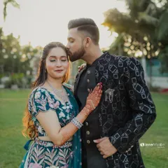 This series of photos captures a stylish couple during their Sangeet. From a romantic forehead kiss to playful poses, these shots showcase their beautiful coordinated outfits and happy connection.