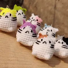 An army of adorable chubby kitten keychains. These were made as part of a custom order and are available in a variety of colors to match your style.