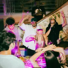 The whole crew on deck, vibing with the crowd. As a DJ and MC, I love creating a shared experience where everyone, from the artists to the audience, is part of the moment.