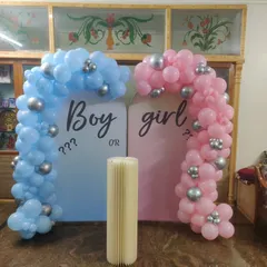 Planning a surprise? Our "Boy or Girl" gender reveal decorations create the perfect moment of anticipation. This setup features two distinct balloon arches in blue and pink, setting a fun and exciting stage for the big reveal.