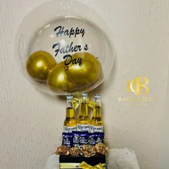 For the dad who enjoys a cold one. This hamper features Corona beers, Ferrero Rocher chocolates, and a "Happy Father's Day" balloon.