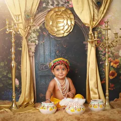 Another joyful expression from our little Kanha. This portrait captures the playful spirit of Lord Krishna amidst a beautifully detailed and festive backdrop.