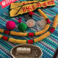 The wedding season rush, or 'लगीनघाई', is not just in the wedding home, but here in my workshop too. This photo shows a Ganpati toran and a marigold garland in progress, essential items for the Maharashtrian 'Rukhwat' wedding display.