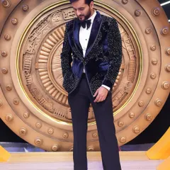 We designed this stunning blue velvet tuxedo for YouTuber Fukra Insaan for the show 'Game of Greed'. The jacket features intricate black beadwork, offering a modern take on classic formal wear.