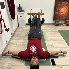 This is Viparita Karani (Legs Up the Wall Pose) with chair and bolster support. This powerful restorative inversion calms the nervous system, reduces muscle tension, and improves circulation, making it an excellent practice for deep relaxation and stress relief.