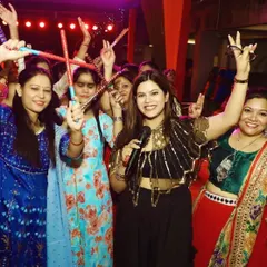 Having a blast at a Dandiya night. There's nothing like the energy of a crowd dancing with dandiya sticks in their hands.