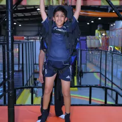 Get ready to fly across the park on our indoor zipline! It's a thrilling ride that gives kids a unique bird's-eye view of the action below, all while secured in a professional safety harness.