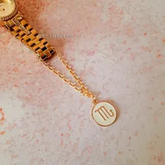 Show off your star sign with this Scorpio zodiac watch charm. The simple white and gold enamel charm adds a personal touch to your watch.