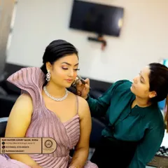 A glimpse into the makeup process at my luxury salon in Noida. I am focused on creating a flawless base for this client's engagement look.