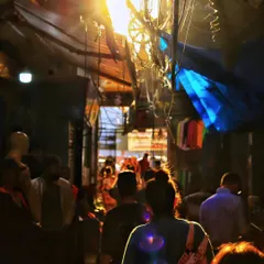 A photograph should make you feel something, even smell the street it was taken on. This is the beautiful chaos of a narrow market lane, where the mix of light, shadow, and moving people tells the story of a city's pulse.