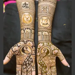 The full view of the engagement henna with pet portraits. The peacocks on the palms and the dogs on the arms make for a truly one-of-a-kind design.