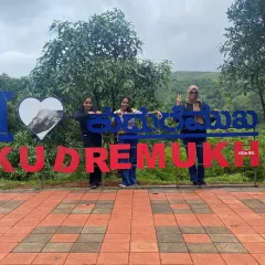A group of trekkers posing at the "I Love Kudremukha" sign, a great spot to celebrate the start or end of this beautiful trek.