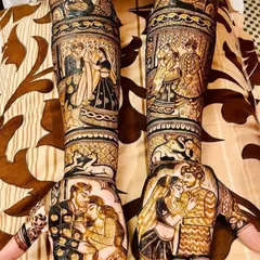 This full-arm design tells a complete love story, with romantic couple portraits on the palms and scenes of the wedding ceremony, like the jaimala, detailed up the arms.