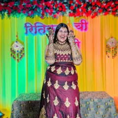 The pure joy of a mehendi ceremony! A happy bride laughing and showing off her elaborate henna, ready for her big day.