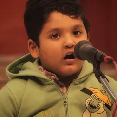 One of our "little champs" singing with all his heart at the 'Swarveni Aradhana'. It is beautiful to see devotion blossom at such a young age.