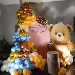 A front view of my popular teddy bear themed baby shower decor. This setup features a large teddy bear prop next to a custom arched backdrop and a colorful balloon arrangement, creating a perfect photo opportunity.