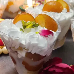 My Gulab Jamun Tres Leches is a festive favorite. It has layers of soft, milk-soaked cake and juicy gulab jamuns, topped with light cream and garnished with pistachios.