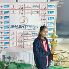 Another one of our champions holding her trophy. We provide a platform for girls to shine and become leaders on the football pitch.