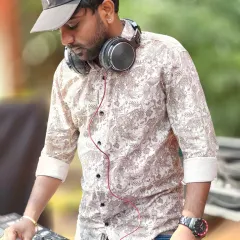 Focused on the details. Every transition and track selection is carefully considered to maintain the flow of energy and keep the party going.