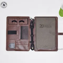 An elegant and highly functional gift for the 20th anniversary of Applied Materials India. This custom diary includes built-in organizers for cables, cards, and a pen, all housed in a sophisticated brown leather-style folder.