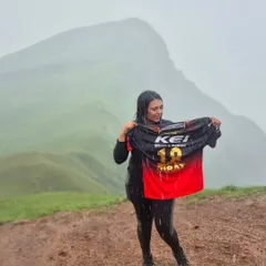 A true RCB fan showing her support for Virat Kohli, even in the rain on the Netravati trek.