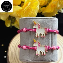 A magical unicorn rakhi for the little dreamer. The cute enamel unicorn charm on a pink braided thread is perfect for celebrating a whimsical bond.