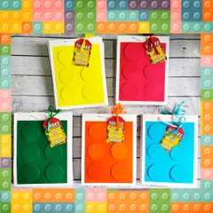 The handmade paper bags for the building block theme are one of my specialties. They come in bright colors with 3D dots to look like giant bricks.