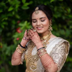 The final look is everything. Here you can see how the rich henna stain complements the bride's stunning wedding attire, adding a layer of tradition and elegance to her special day.