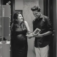 Sharing a laugh over old memories or dreams for the future. This candid, black and white shot captures a genuine moment of joy and connection between you.