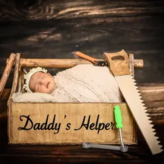 Daddy's little helper, already on the job! This creative newborn photo uses a toolbox and tools as props for a charming and unique portrait that celebrates the bond between a father and his child.