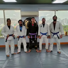 A throwback photo of our BJJ team and coaches. This picture represents the journey and the bonds forged through countless hours of rolling on the mats.