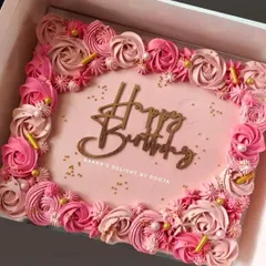 This pink ombre floral sheet cake is perfect for a large birthday gathering. It's a practical way to serve many guests while still offering a beautiful, handcrafted dessert.