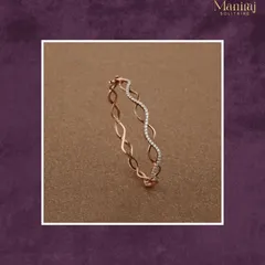 Subtle yet striking. This delicate rose gold bangle features a wave-like design with a section of pave diamonds, adding a touch of elegance to your everyday look.