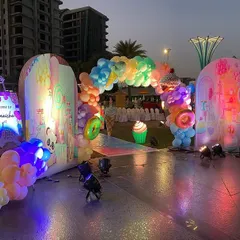 Another view of the Candyland entrance, showing the welcome sign and the colorful pathway leading into the party.