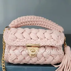 A soft and elegant baby pink crochet puff bag. This one is perfect for a chic, feminine look and adds a touch of handmade luxury.