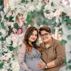 Capturing the happy couple before they welcome their little one. This rustic floral arch with soft lighting provides a romantic and beautiful setting for maternity portraits.