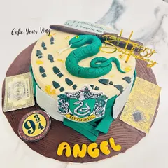 Slytherin pride, baked to perfection. This Harry Potter cake features the house crest, a fondant snake, and the Marauder's Map.