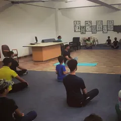 A meditation and breathing exercise session in progress. We teach our athletes mindfulness techniques to quiet the mind and enhance concentration on the range.