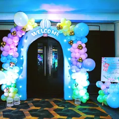 The celebration starts the moment your guests arrive. We created this enchanting welcome arch for a naming ceremony, using a pastel balloon garland and hot air balloon cutouts to set a whimsical tone from the very beginning.
